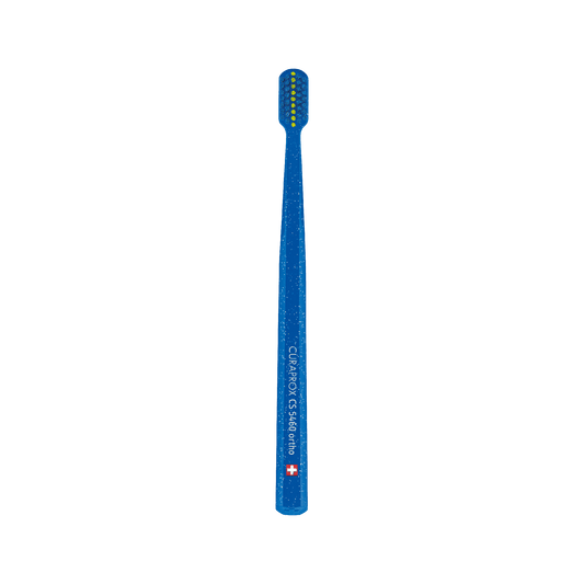 Curaprox CS 5460 orthodontic toothbrush with ultra-soft bristles and V-trim shape for braces care.